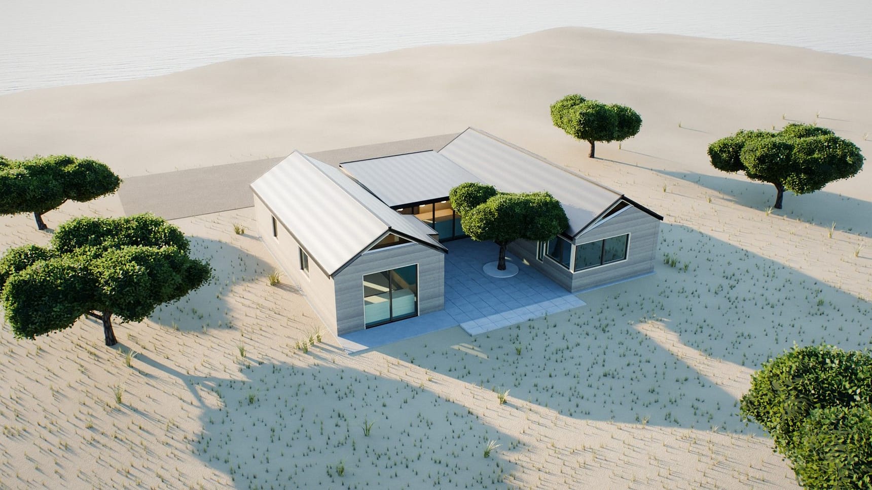 Aerial render of the three boxes around the courtyard, with dune grass and the sea beyond
