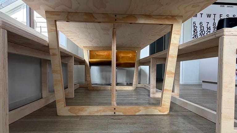 Looking up at the angled legs from floor level